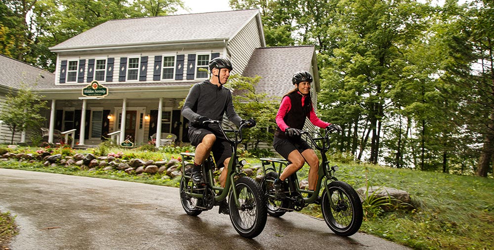 Couple riding bikes and enjoy a getaway at the best Bed and Breakfast in Wisconsin