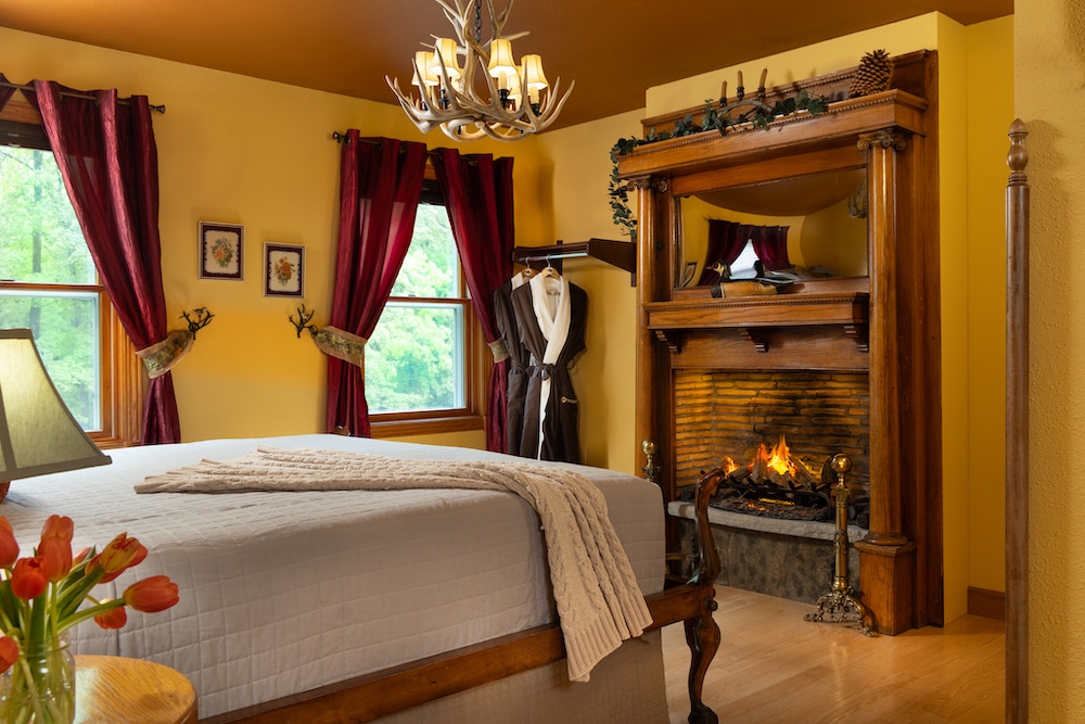 romantic bed and breakfast room with a fireplace, for a romantic weekend getaway near Chicago