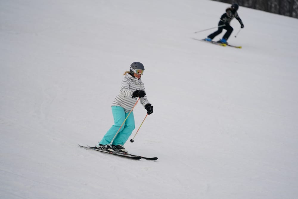Head to Little Switzerland Ski Area This Winter 4 Woman skiing at Wisconsin ski hills like Little Switzerland Ski Area