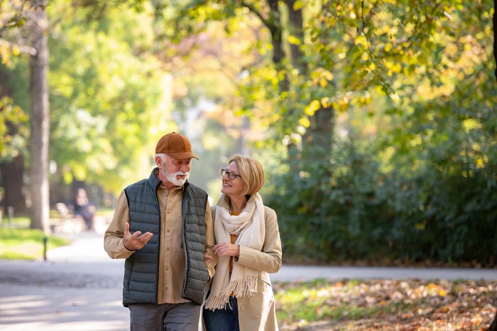Where to Spend Your Weekend Getaways in Wisconsin 2 Stroll along the downtown Riverwalk in West Bend during one of the best weekend getaways in Wisconsin. This couple is walking through the park, deep in conversation.